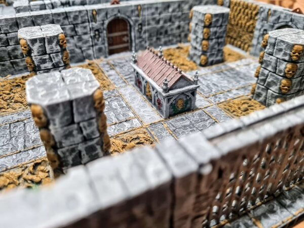 Donjon JDR sur mesure — grande salle avec colonnes crânes dorés, chapelle centrale et sol texturé sable