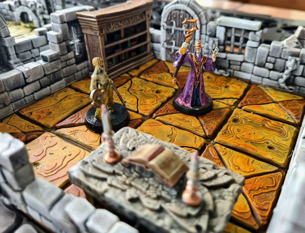 Figurines de sorcier et de zombie HeroQuest sur un plateau de jeu 3D modulaire avec dalles rouges et mobilier.