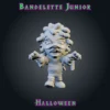 Bandelette Junior-01 Bandelette Junior, figurine de petite momie en résine 28 mm aux bras tendus, bandelettes qui se défont, cheveux bouclés et dent manquante