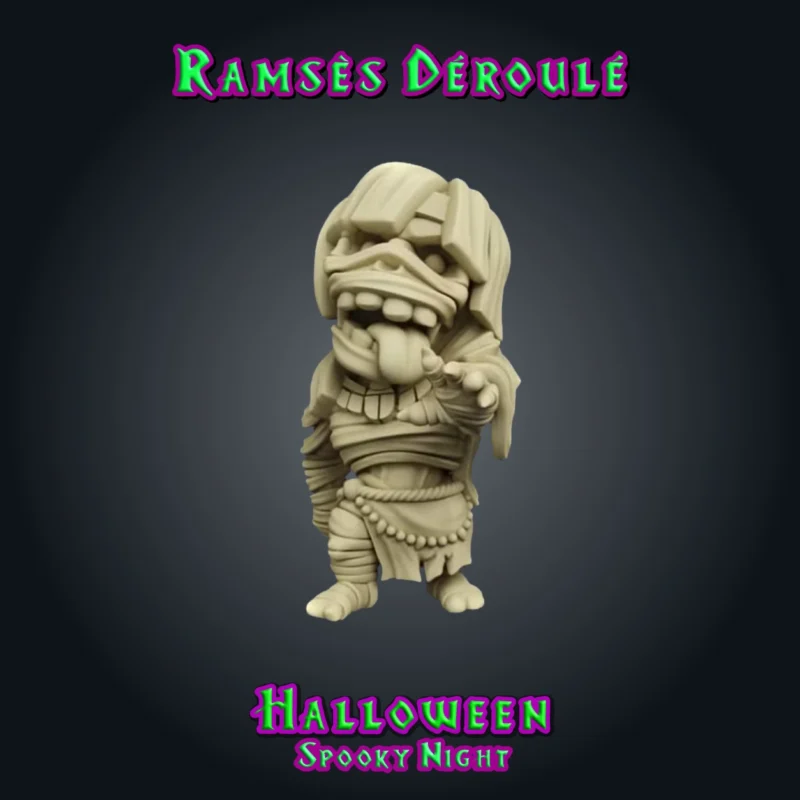 Ramsès Déroulé, figurine de momie en résine 28 mm, bandelettes en désordre, grands yeux ronds, langue tirée, main tendue, collier et pagne à perles vue brute